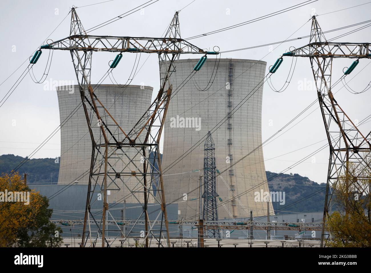 Electrical power pylons of high-tension electricity power lines are seen in front the cooling towers of the Tricastin nuclear power plant site in Saint-Paul-Trois-Chateaux, France, November 21, 2022.    REUTERS/Eric Gaillard Stock Photo