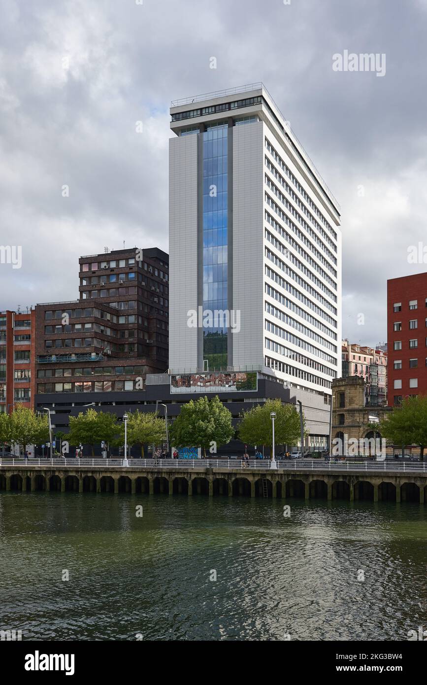 View of the Nevion river and office skyscraper at Bilbao, Biscay, Basque Country, Euskadi, Euskal Herria, Spain, Europe. Stock Photo