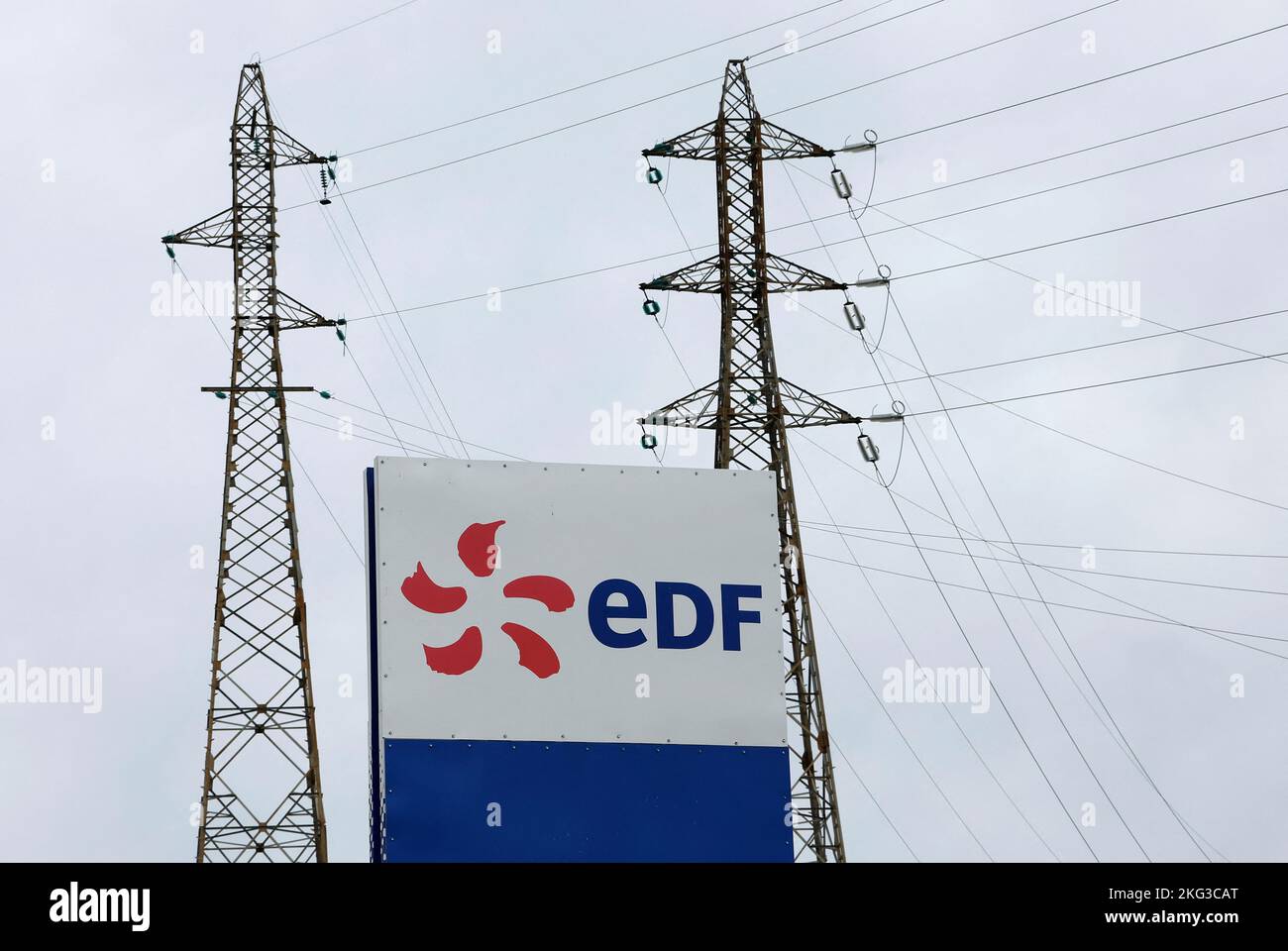 The logo of Electricite de France (EDF) is seen in front of electrical pylons at the Tricastin nuclear?power plant site in Saint-Paul-Trois-Chateaux, France, November 21, 2022.    REUTERS/Eric Gaillard Stock Photo