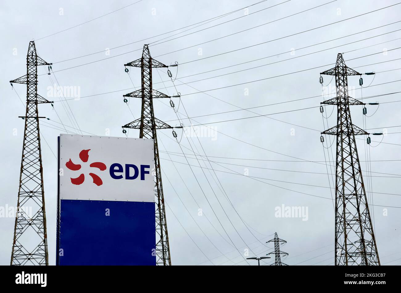 The logo of Electricite de France (EDF) is seen in front of electrical pylons at the Tricastin nuclear power plant site in Saint-Paul-Trois-Chateaux, France, November 21, 2022.    REUTERS/Eric Gaillard Stock Photo