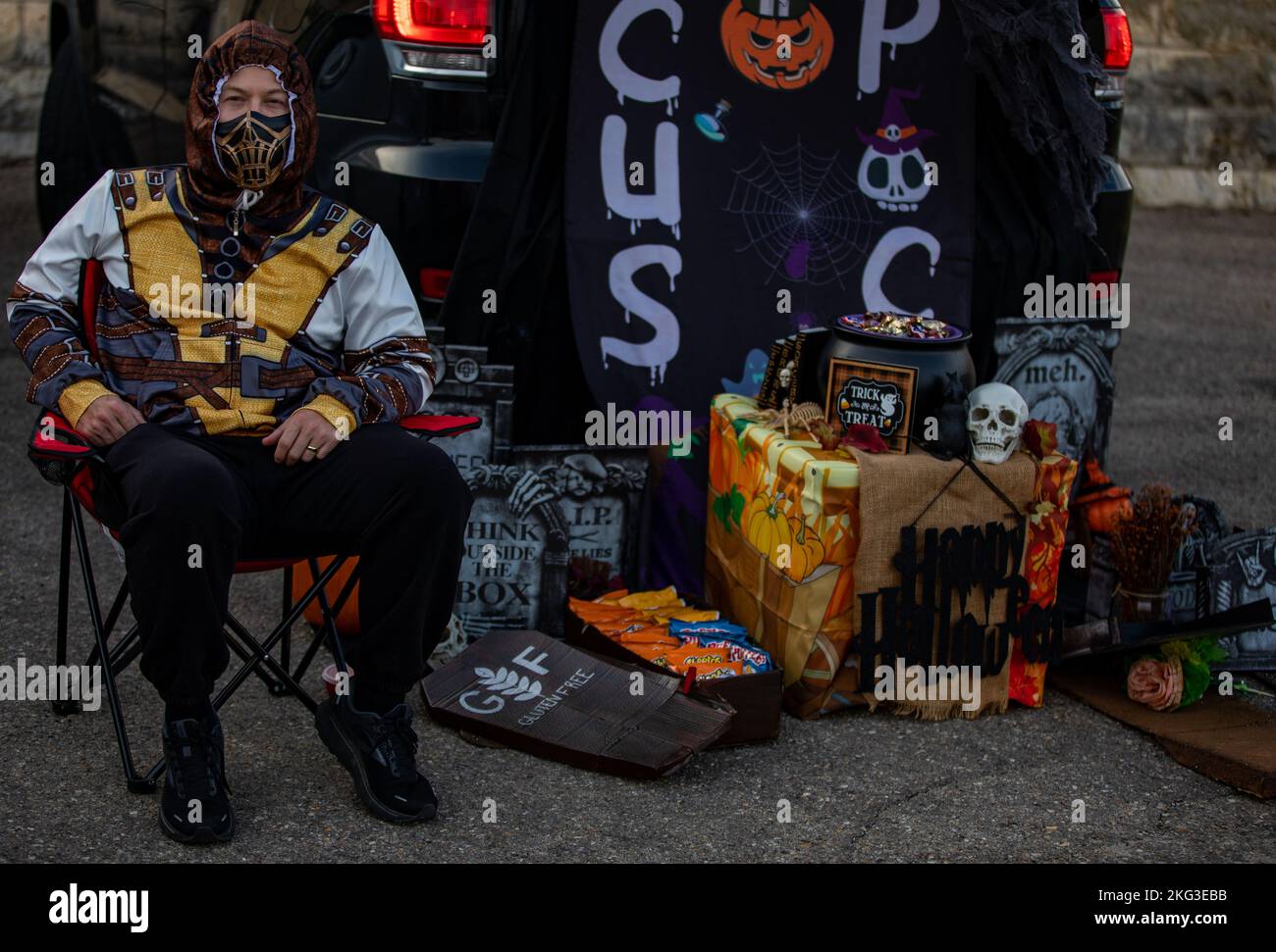 A Fort Riley community member waits at their Halloween display at the ...
