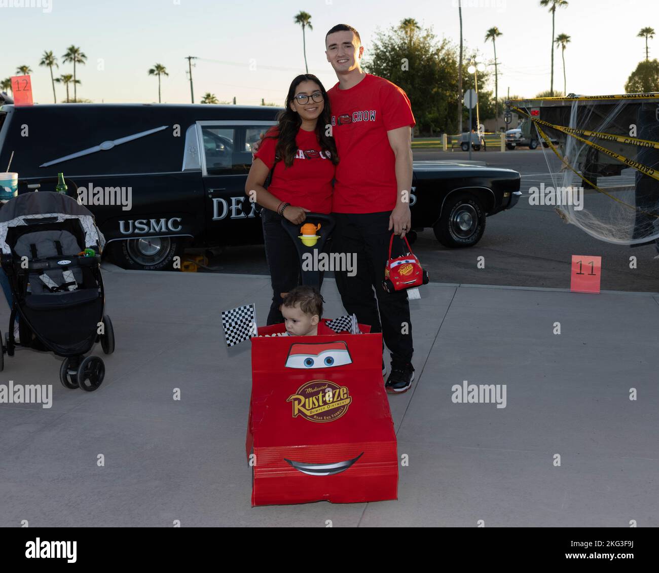 A family poses for a photo during the 8th annual Trunk or Treat at