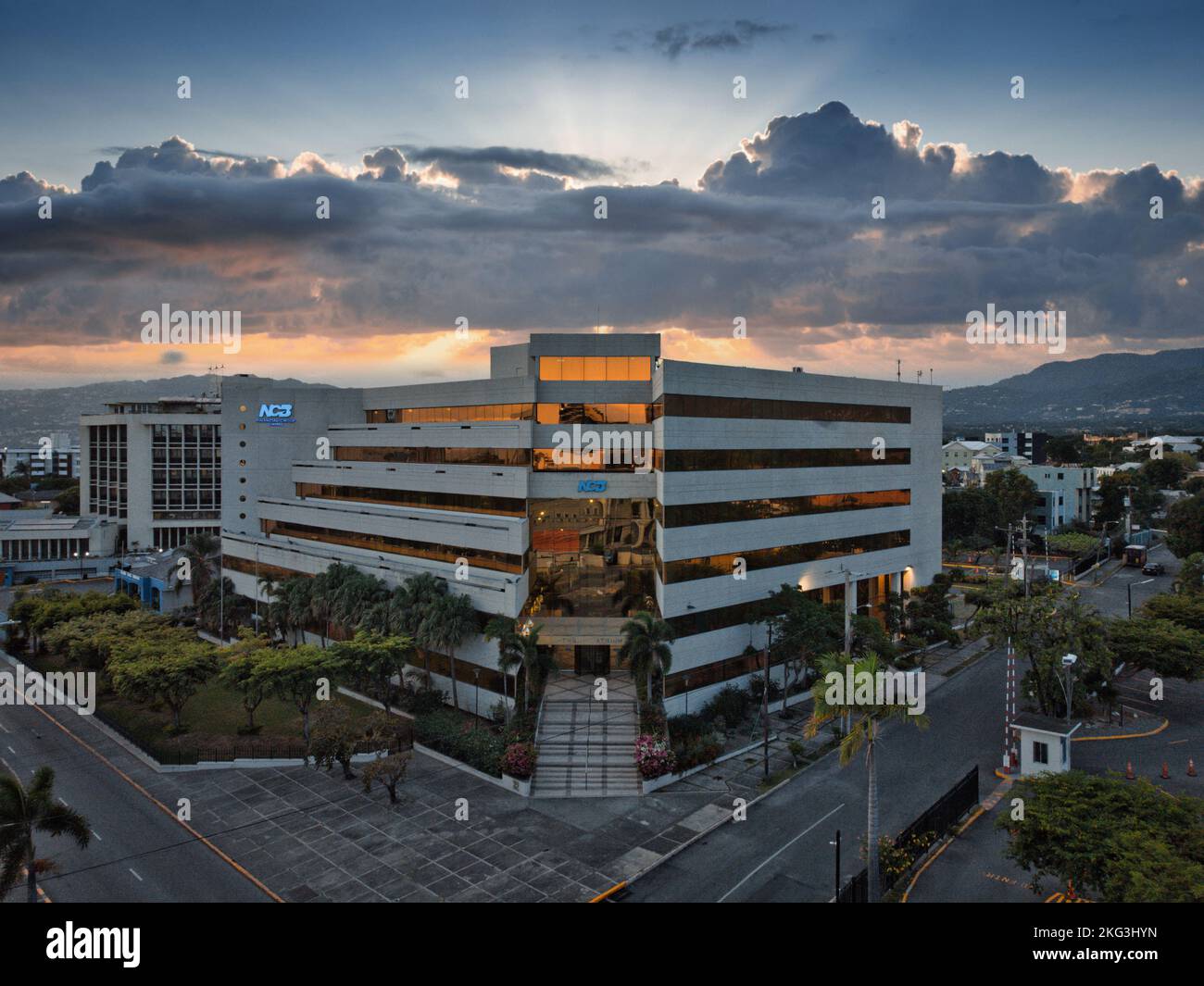 The aerial view of the National Commercial Bank Jamaica building before the sunset skyline Stock
