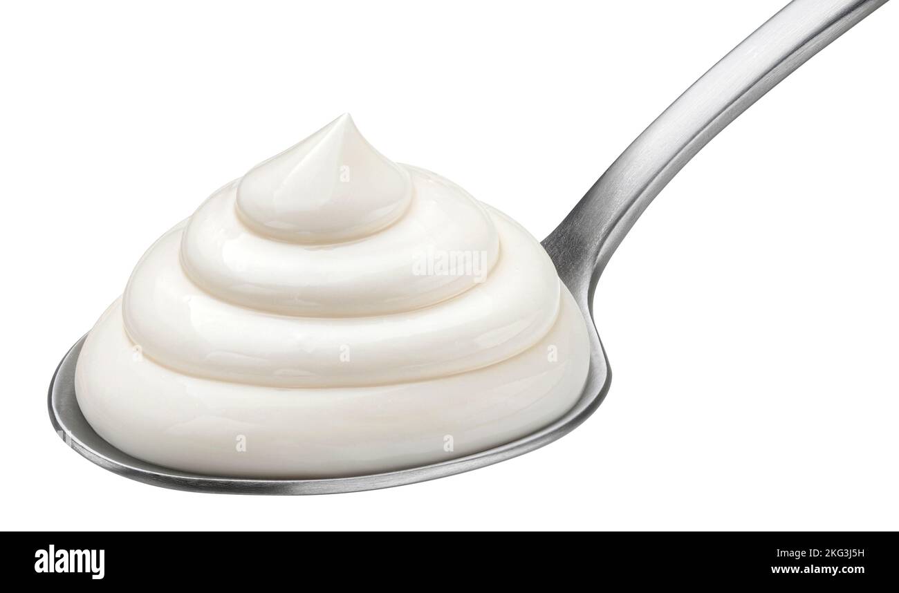 Mayonnaise in spoon isolated on white background, full depth of field