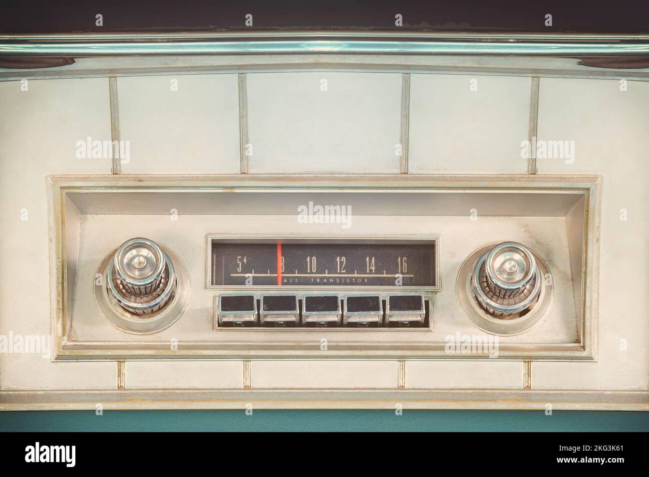 Old car radio inside a green classic American car with chrome dashboard Stock Photo