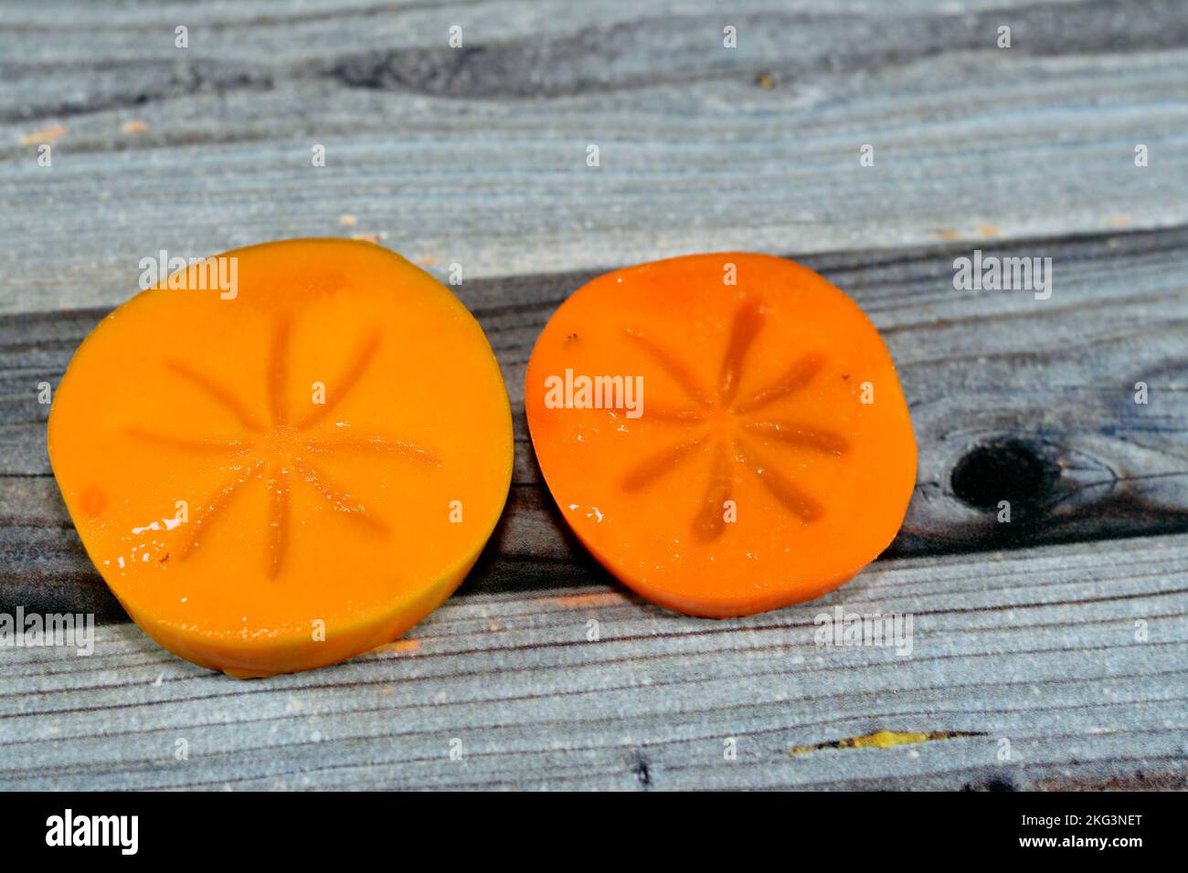 The persimmon is the edible fruit of a number of species of trees in
