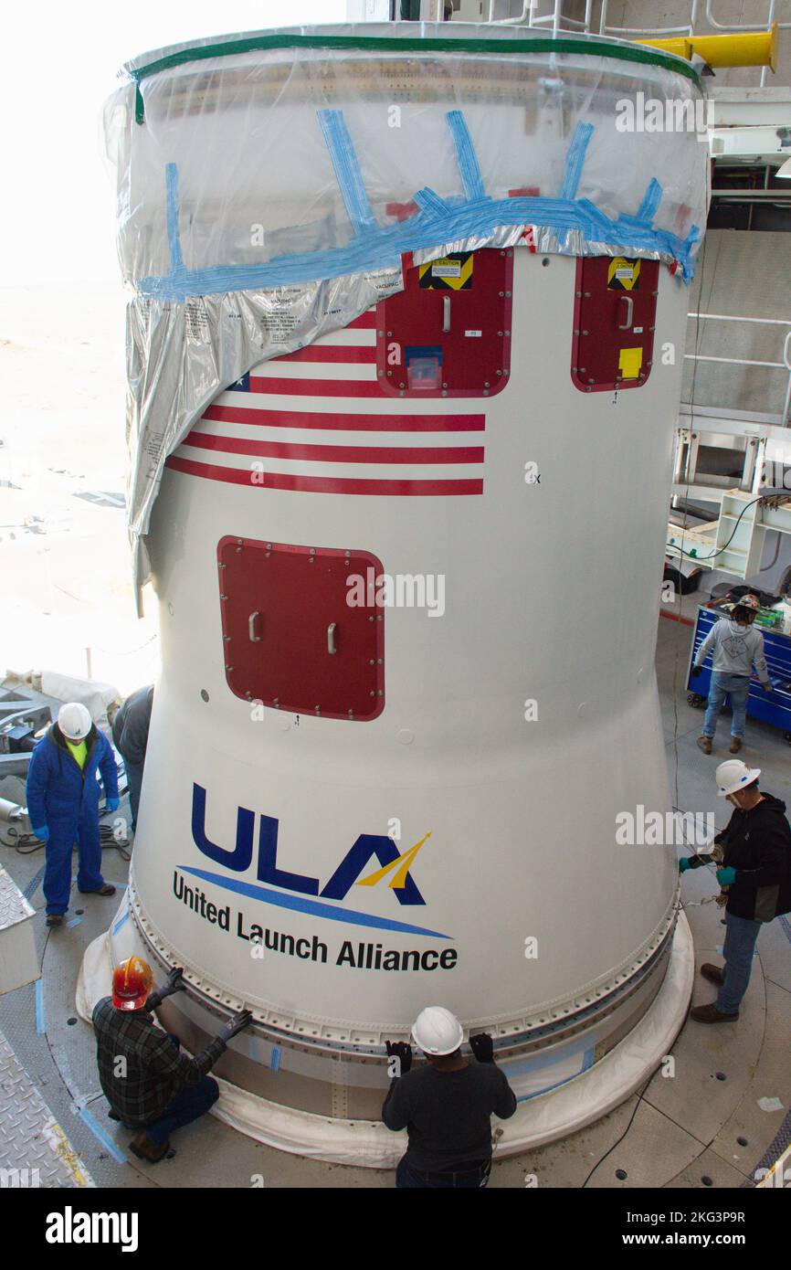 JPSS-2 ISA ASA Hoist. Technicians help secure the United Launch Alliance Atlas V interstage adapter and aft stub adapter to the Atlas V rocket inside the vertical integration facility at Space Launch Complex-3 at Vandenberg Space Force Base in California on Sept. 29, 2022. The rocket is being prepared to launch the National Oceanic and Atmospheric Administration’s (NOAA) Joint Polar Satellite System-2 (JPSS-2). JPSS-2 and NASA’s Low-Earth Orbit Flight Test of an Inflatable Decelerator (LOFTID) secondary payload. The launch is scheduled for Nov. 1 from SLC-3. JPSS-2, which will be renamed NOAA- Stock Photo