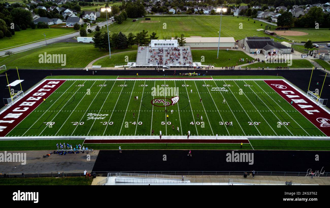 An aerial of a Canal Winchester football stadium with players and fans
