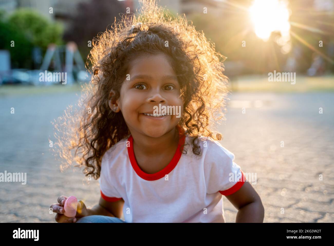 Kid posing for the camera during a creative outdoor activity Stock Photo