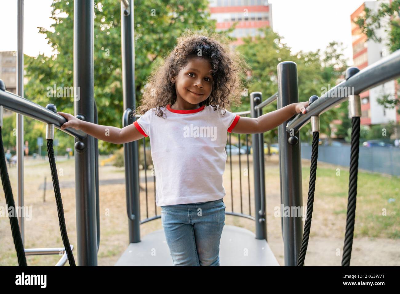 Cute child posing for the camera on the playground Stock Photo