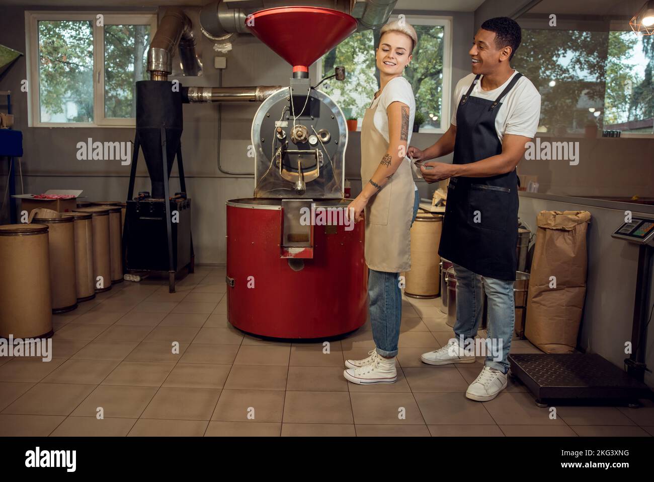 Joyous coffee roasters getting ready for work Stock Photo