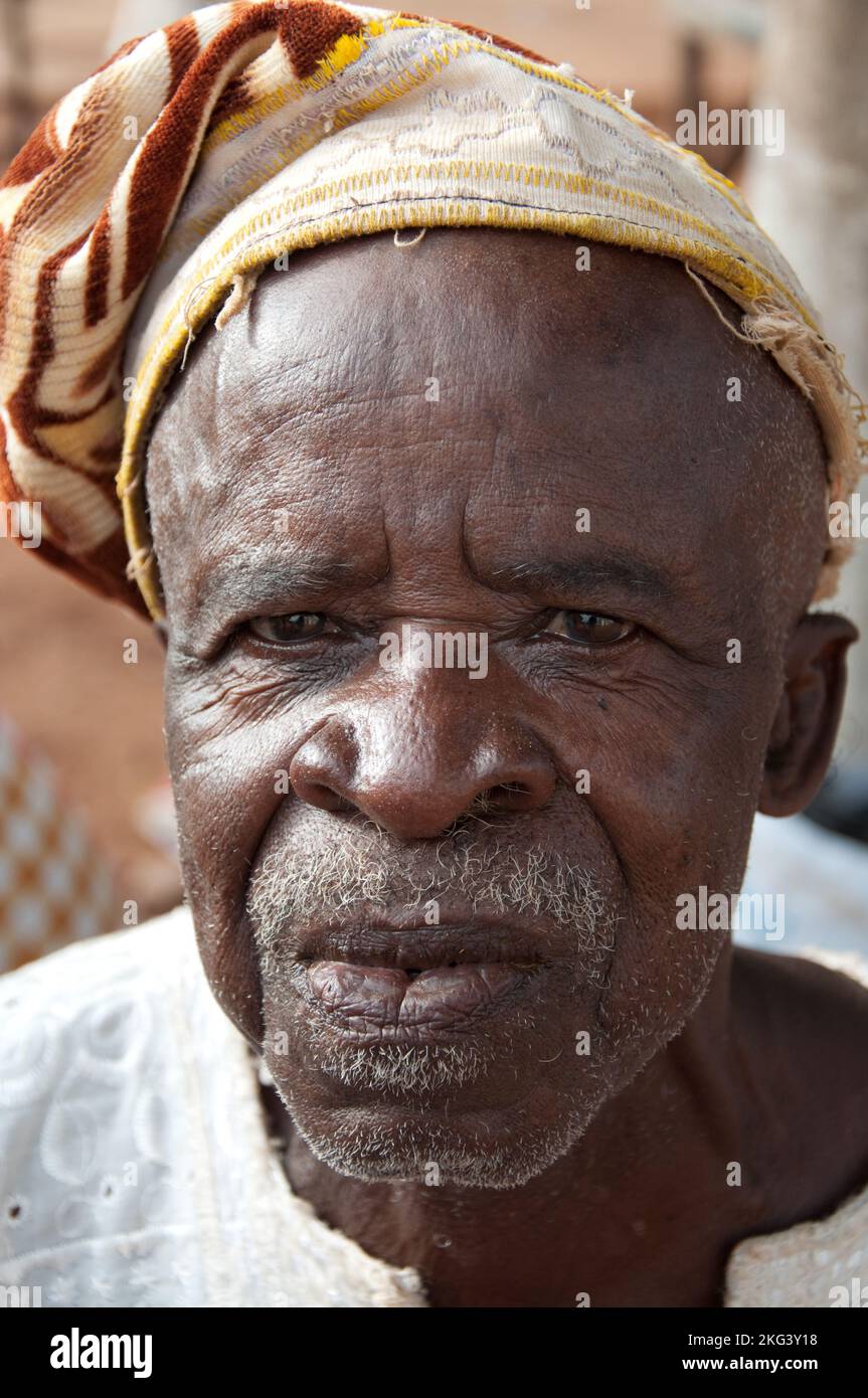 Village elder, Older man in traditional African dress; Natitingou, Atacora, Benin Stock Photo