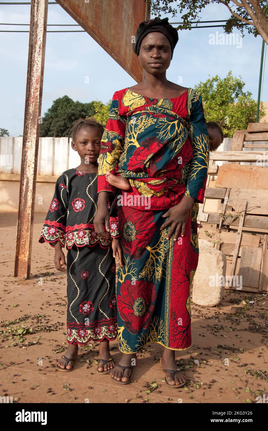 small family - mother and two children in traditional African dress;  Natitingou, Atacora, Benin Stock Photo - Alamy, image size:863x1390