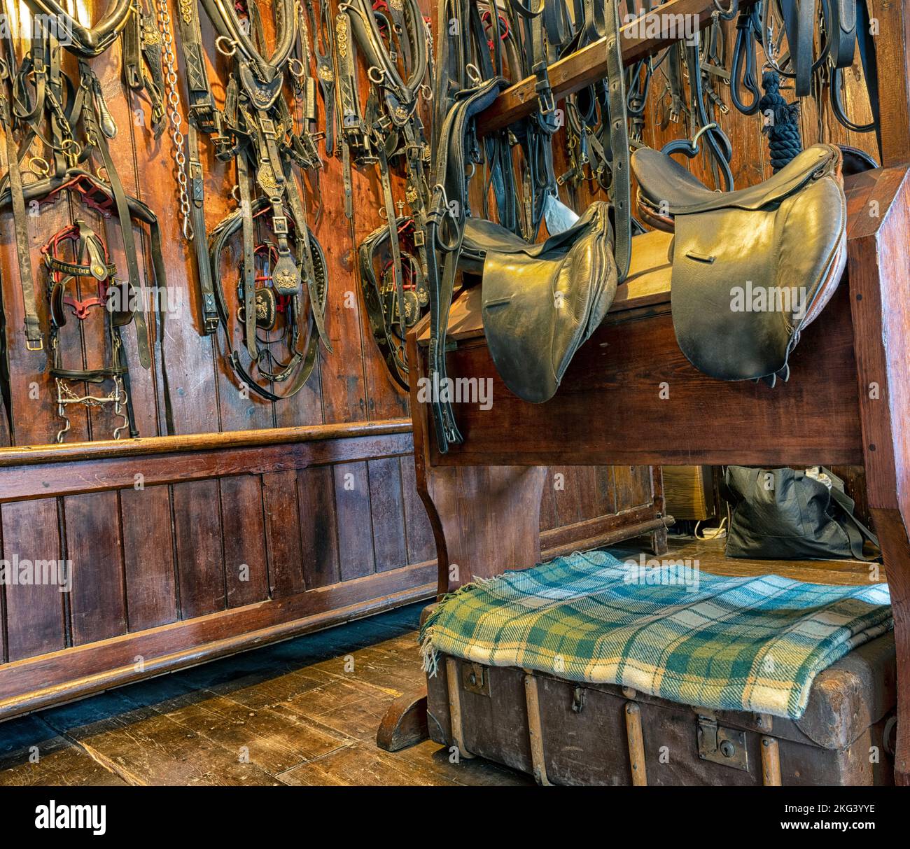 Tack Room showing horse collars, leather harness and saddles in the