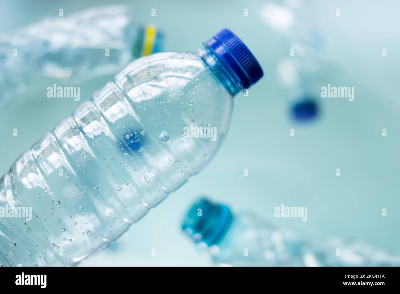 Some plastic bottles on blue background Stock Photo