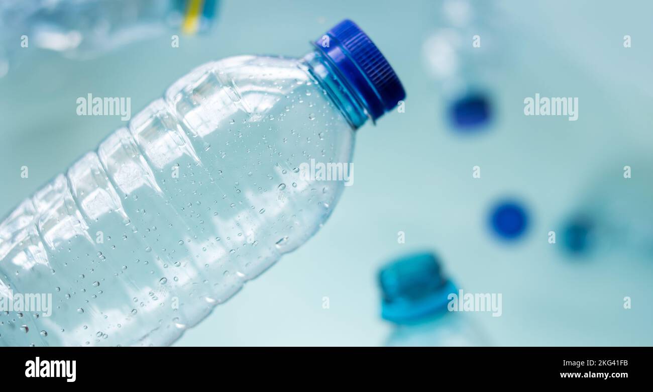 Some plastic bottles on blue background Stock Photo