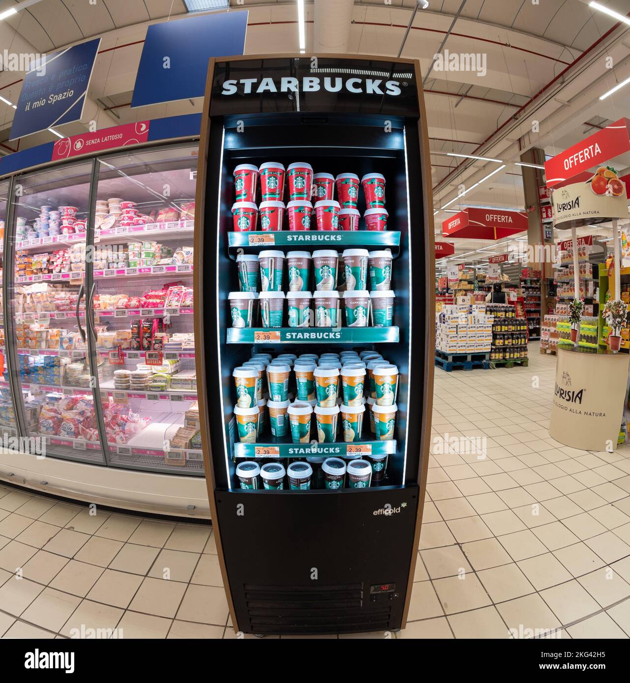 Cuneo, Italy - November 18, 2022: Starbucks products in shop window refrigerator with coffee and milk and cappuccino and caramel cardboard cups in ita Stock Photo