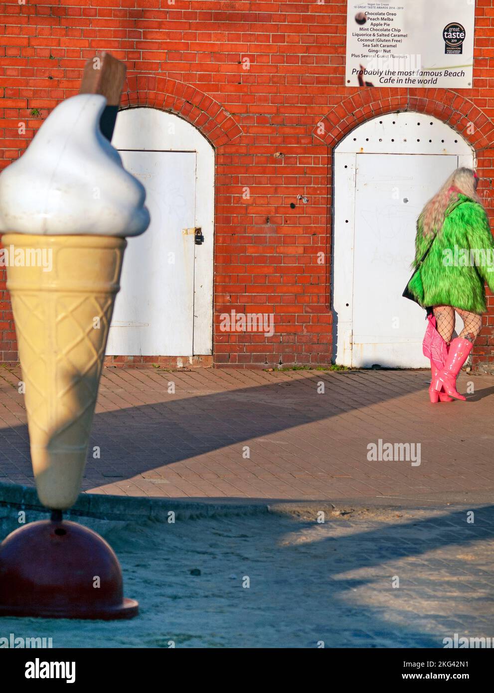 Pink boots and ice cream on the Brighton seafront Stock Photo Alamy