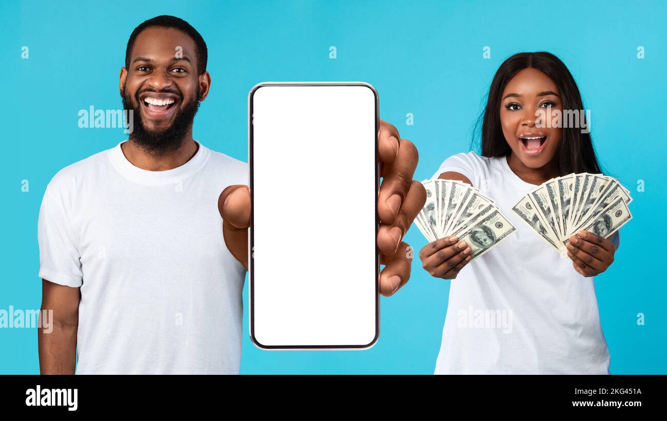 Excited African American couple holding a lot of dollar money Stock ...