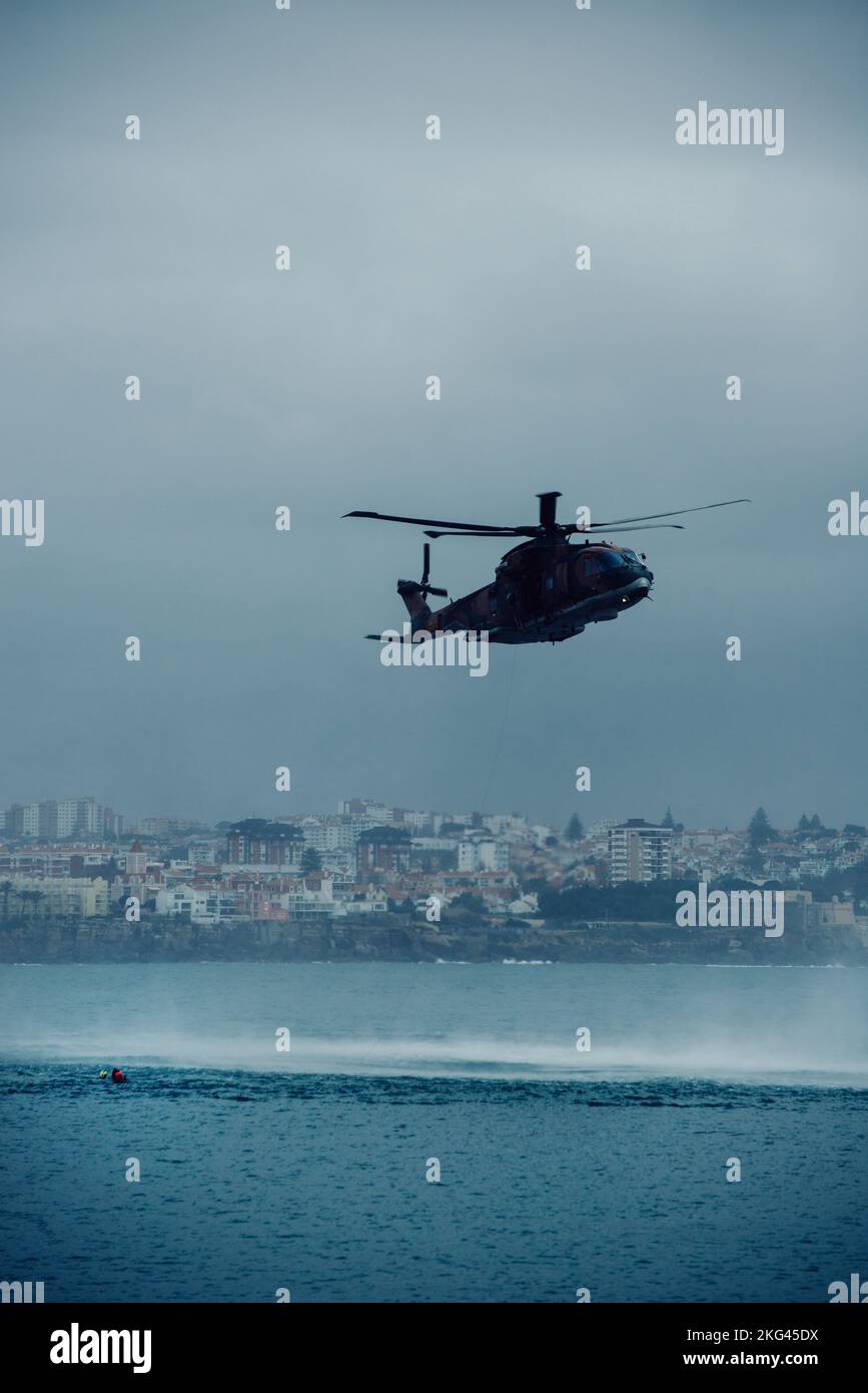 Portuguese Airforce helicopter engages in a rescue exercise in Cascais Bay on November 16, 2022 Stock Photo