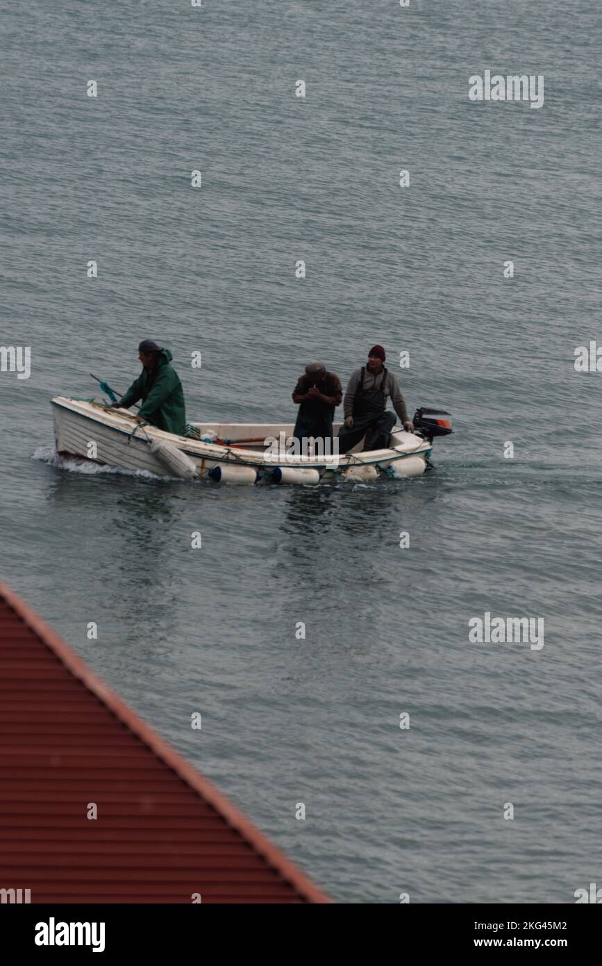 Fishermen on Cascais Bay, Portugal Stock Photo