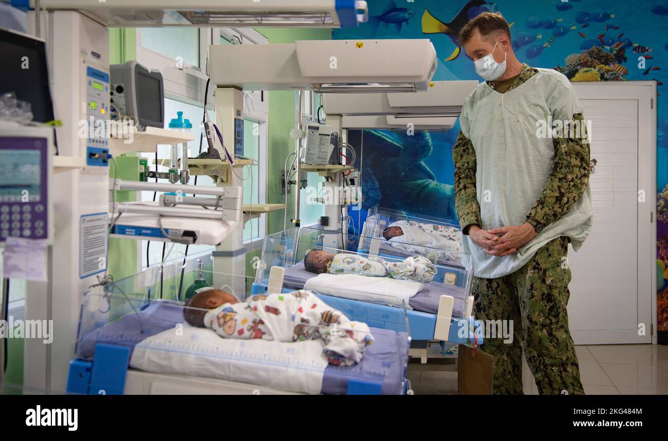 221028-N-MY642-1007  PUERTO BARRIOS, Guatemala (Oct. 28, 2022) Cmdr. Michael Cunningham, a pediatric cardiologist from Chesapeake, Virginia, looks over premature children at the Hospital Nacional Infantil as part of a subject matter expert best-practices exchange during the hospital ship USNS Comfort’s (T-AH 20) Continuing Promise mission on Oct. 28, 2022. Comfort is deployed to U.S. 4th Fleet in support of Continuing Promise 2022, a humanitarian assistance and goodwill mission conducting direct medical care, expeditionary veterinary care, and subject matter expert exchanges with five partner Stock Photo
