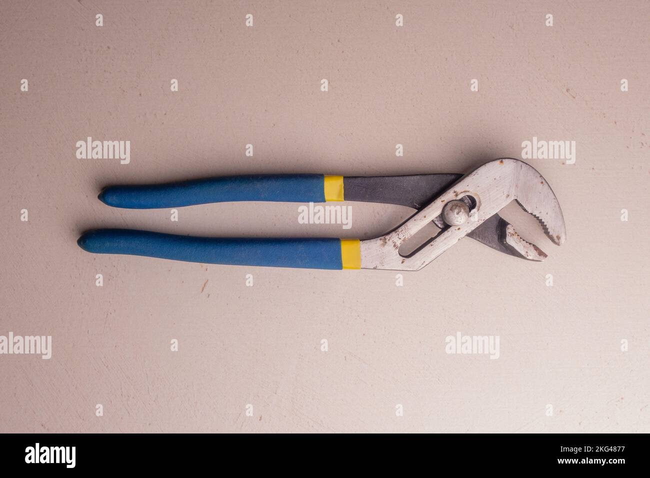 Adjustable plumbing wrench with blue handles. Joiner's hand tool Stock