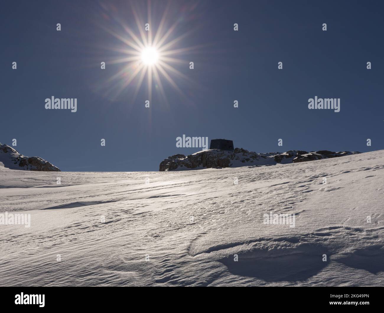 Bright mountain midday sun and hard firn on Dachstein glacier, Austria, Alps Stock Photo