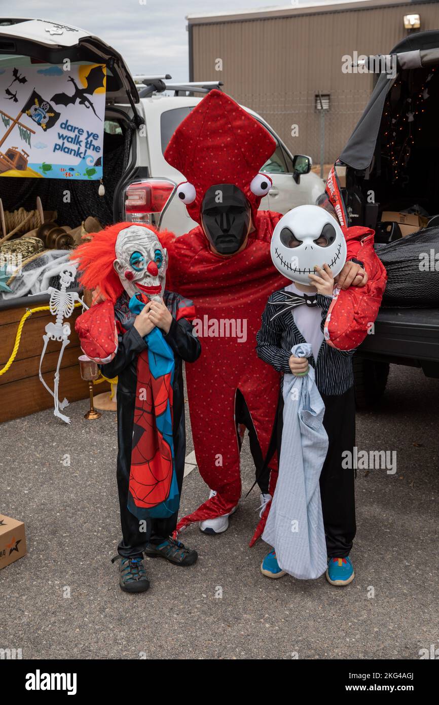 U.S. Army SSG Thomas Tran and two little trick or treaters during the