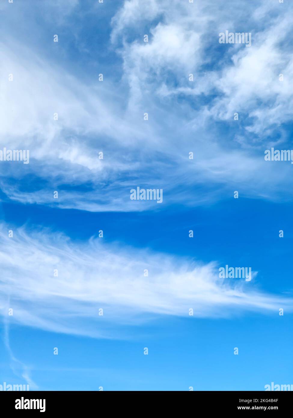 Stunning cirrus cloud formation panorama in a deep blue summer sky seen ...