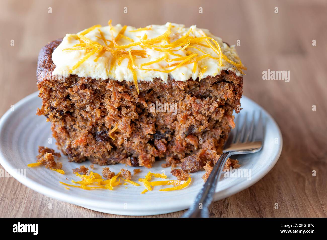 A home baked Carrot and Tamarind cake. The cake is made using a traditional recipe with the addition of tamarind. It has a cream cheese frosting Stock Photo