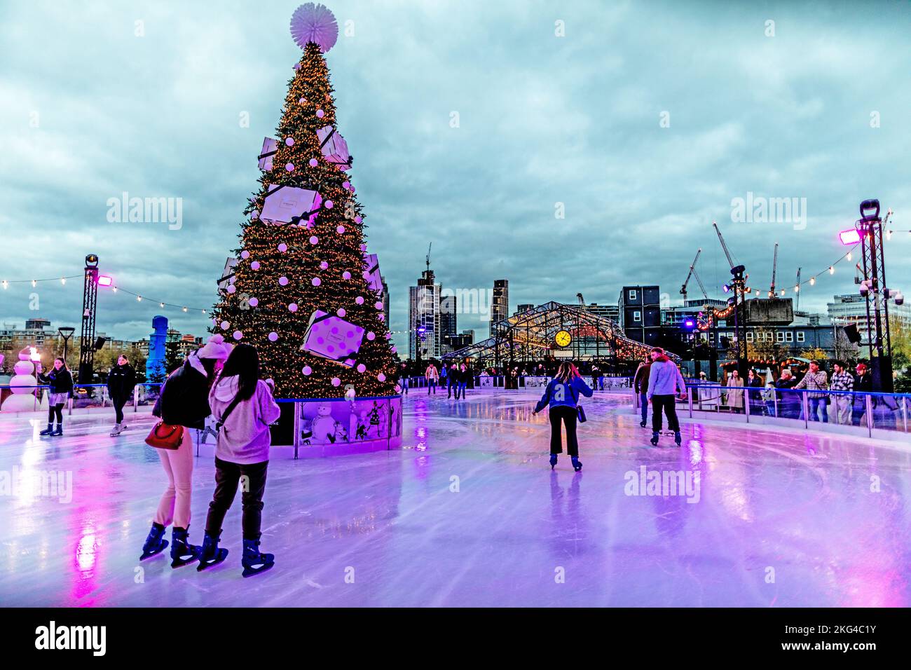 Ice Skating At Battersea Power Station at Night London UK Stock Photo