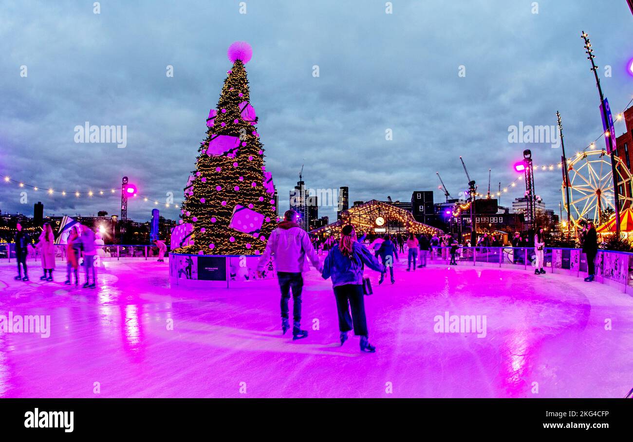 Ice Skating At Battersea Power Station at Night London UK Stock Photo