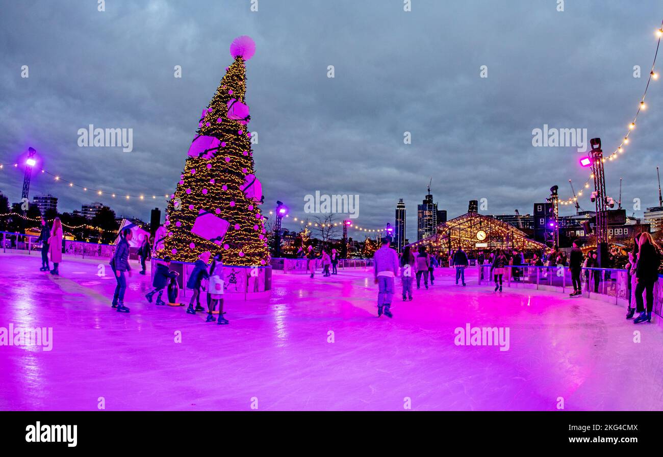 Ice Skating At Battersea Power Station at Night London UK Stock Photo