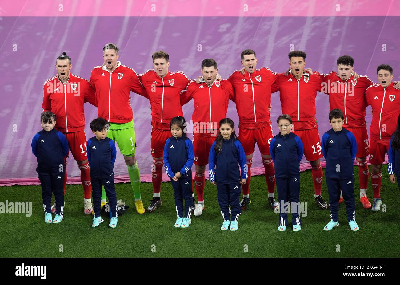 Wales captain Gareth Bale (left) and team-mates line up for the national anthem during the FIFA World Cup Group B match at the Ahmad Bin Ali Stadium, Al-Rayyan, Qatar. Picture date: Monday November 21, 2022. Stock Photo