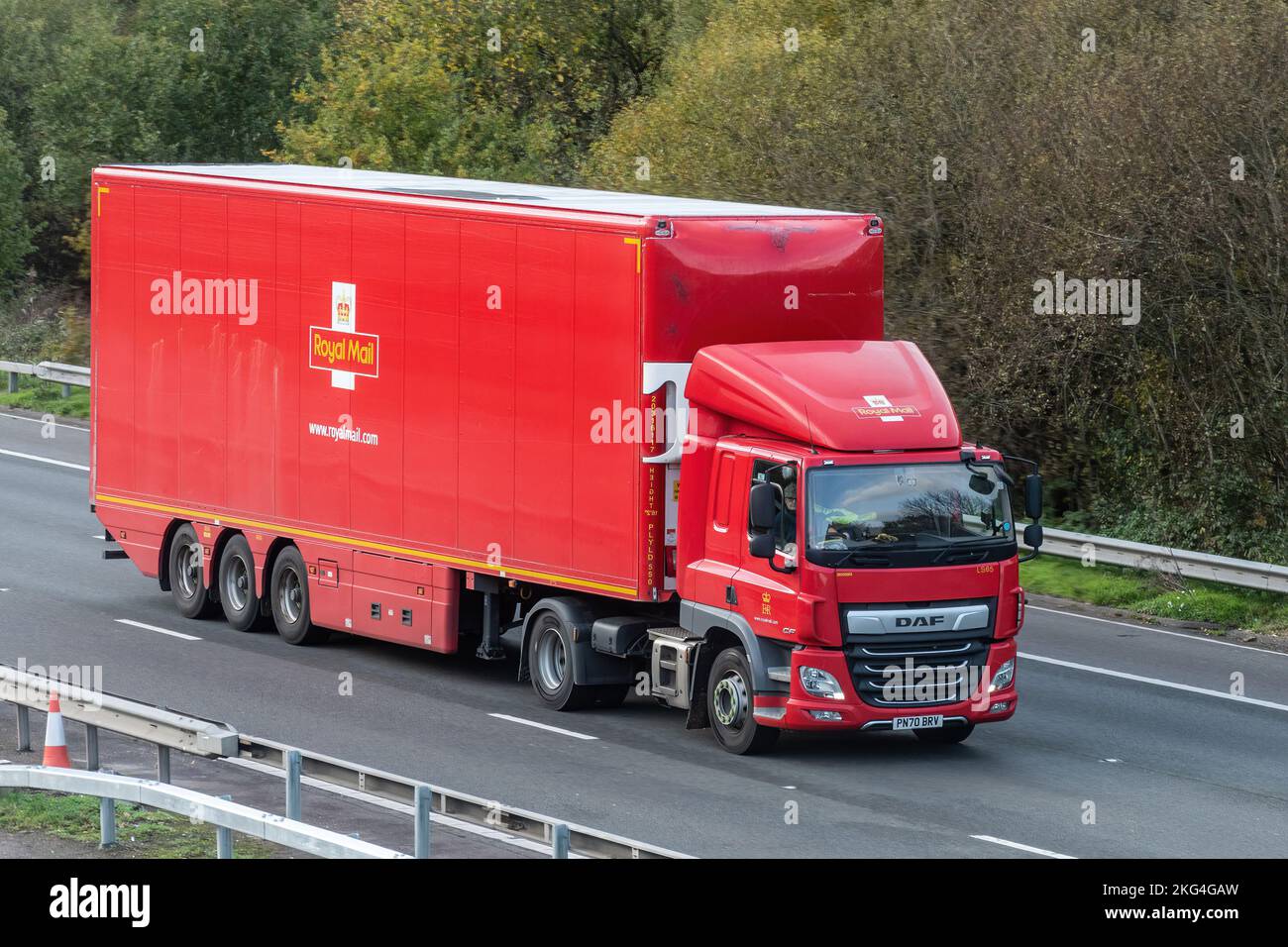 Red Royal Mail HGV lorry travelling on the M3 motorway, England, UK