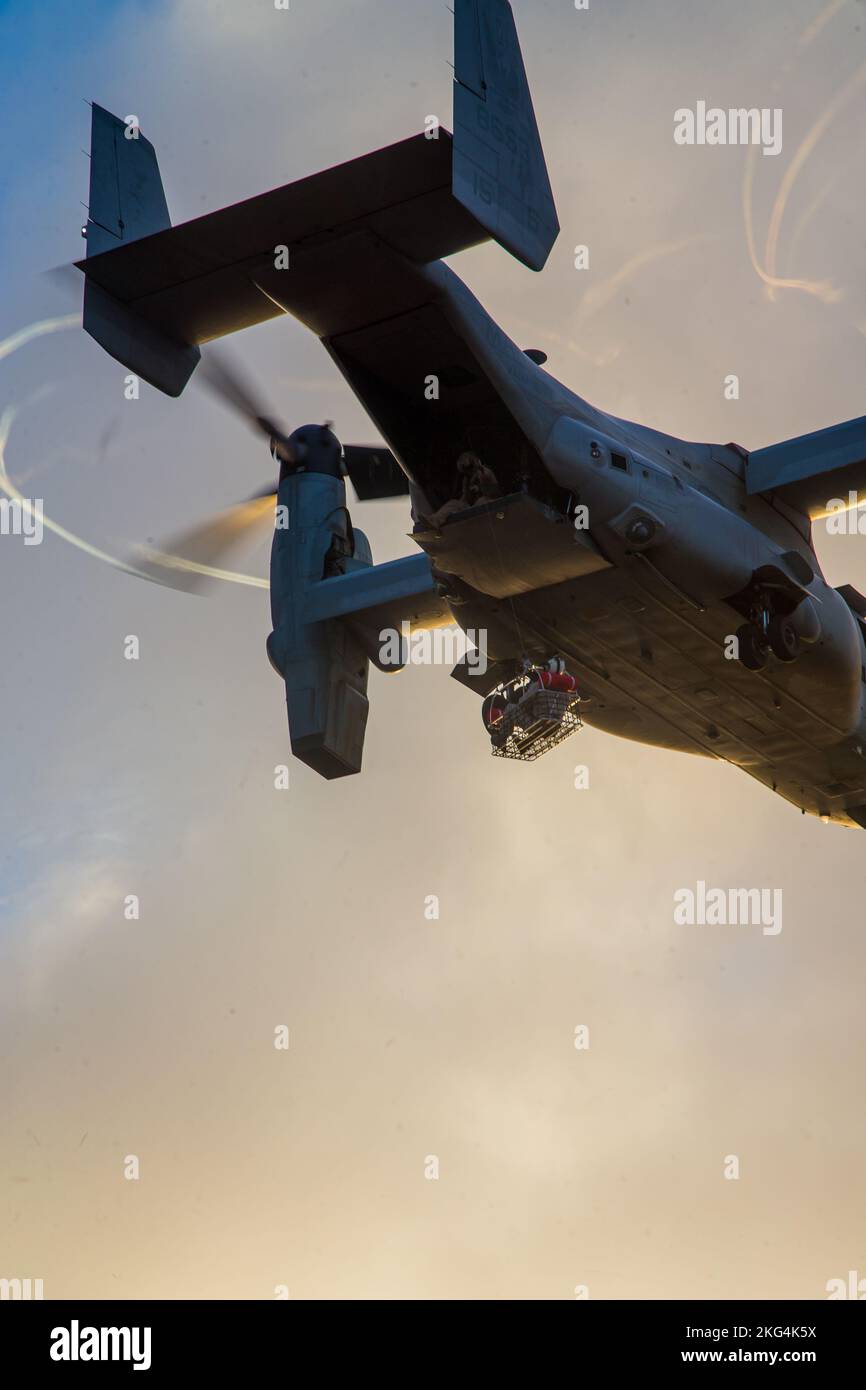 A U.S. Marine Corps MV-22B Osprey assigned to Marine Aviation Weapons and Tactics Squadron One (MAWTS-1), conducts live hoist exercises during Weapons and Tactics Instructor (WTI) course 1-23 at San Clemente Island, California, Oct. 28, 2022. WTI is a seven-week training event hosted by MAWTS-1, providing standardized advanced tactical training and certification of unit instructor qualifications to support Marine aviation training and readiness, and assists in developing and employing aviation weapons and tactics. Stock Photo