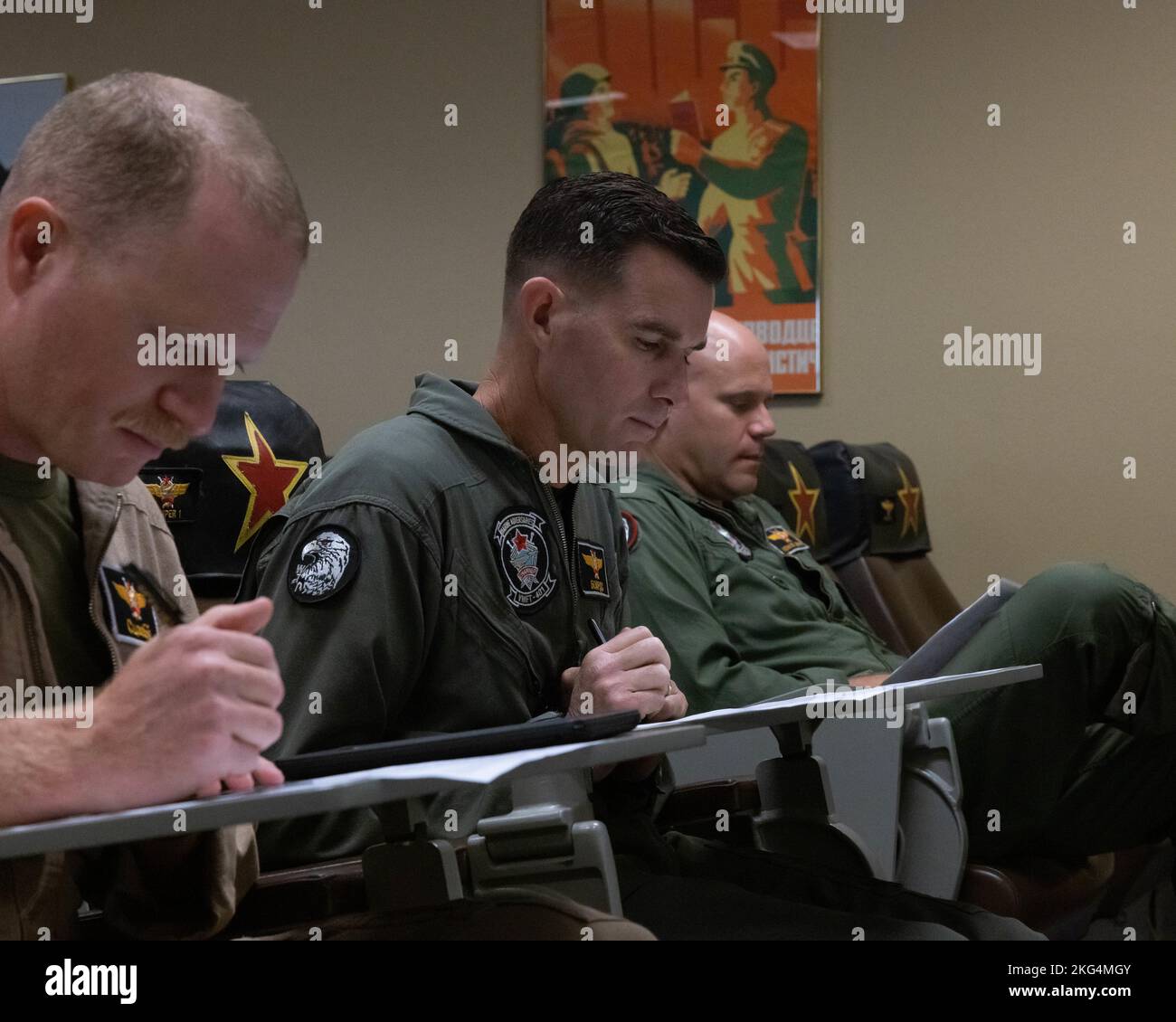 U.S. Marines from various units in the Marine Corps participate in a flight brief given by Lt. Col. Michael Webb, executive officer, Marine Fighter Training Squadron 401 (VMFT-401), Marine Aircraft Group 41, 4th Marine Aircraft Wing, at Marine Corps Air Station Yuma, Arizona, Oct. 28, 2022. VMFT-401 is the only adversary squadron with the mission to act as the opposing force in simulated air combat. Stock Photo