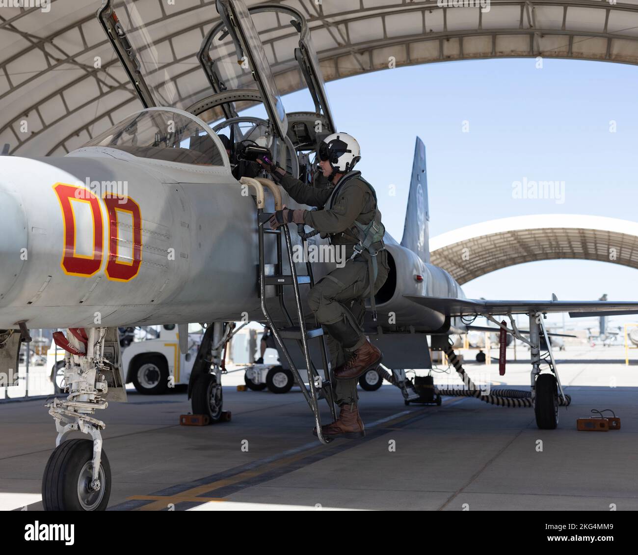 U.S. Marine Corps Lt. Col. Eric Scherrer, commanding officer, Marine Fighter Training Squadron 401 (VMFT-401), Marine Aircraft Group 41, 4th Marine Aircraft Wing, enters an F-5N Tiger II at Marine Corps Air Station Yuma, Arizona, Oct. 28, 2022. VMFT-401 is the only adversary squadron with the mission to act as the opposing force in simulated air combat. Stock Photo