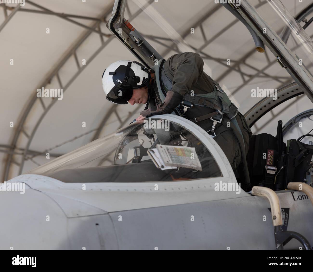 U.S. Marine Corps Lt. Col. Eric Scherrer, commanding officer, Marine Fighter Training Squadron 401 (VMFT-401), Marine Aircraft Group 41, 4th Marine Aircraft Wing, enters an F-5N Tiger II at Marine Corps Air Station Yuma, Arizona, Oct. 28, 2022. VMFT-401 is the only adversary squadron with the mission to act as the opposing force in simulated air combat. Stock Photo