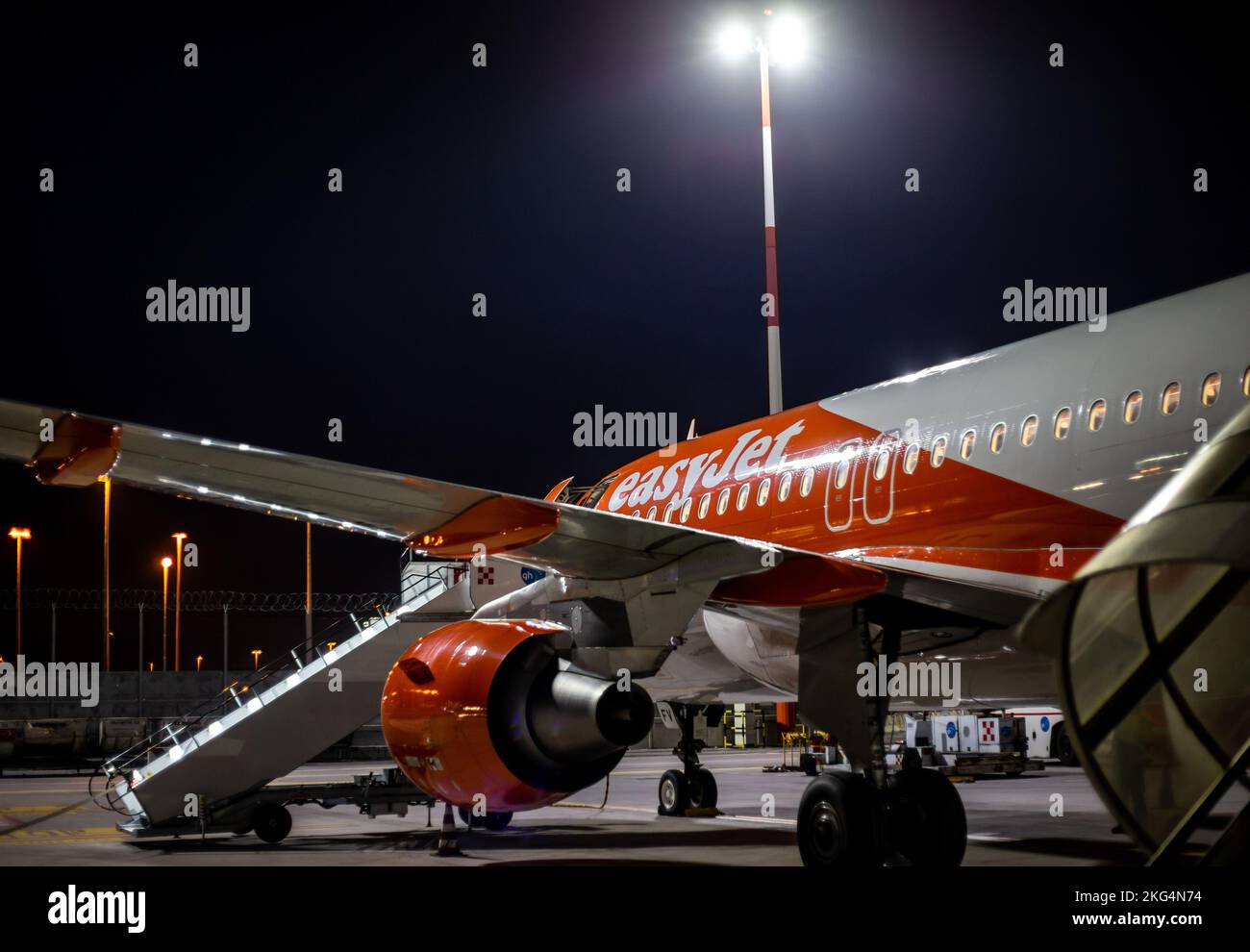 A smart easy jet at night on the tarmac at Venice Marco Polo Airport waiting for passengers to embark from  their business and holidays trips. Stock Photo