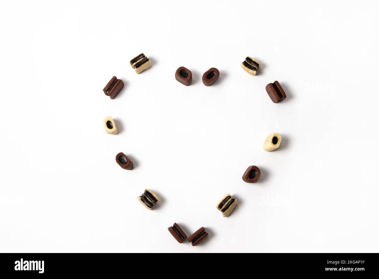 Heart shape of brown and white licorice candies Stock Photo