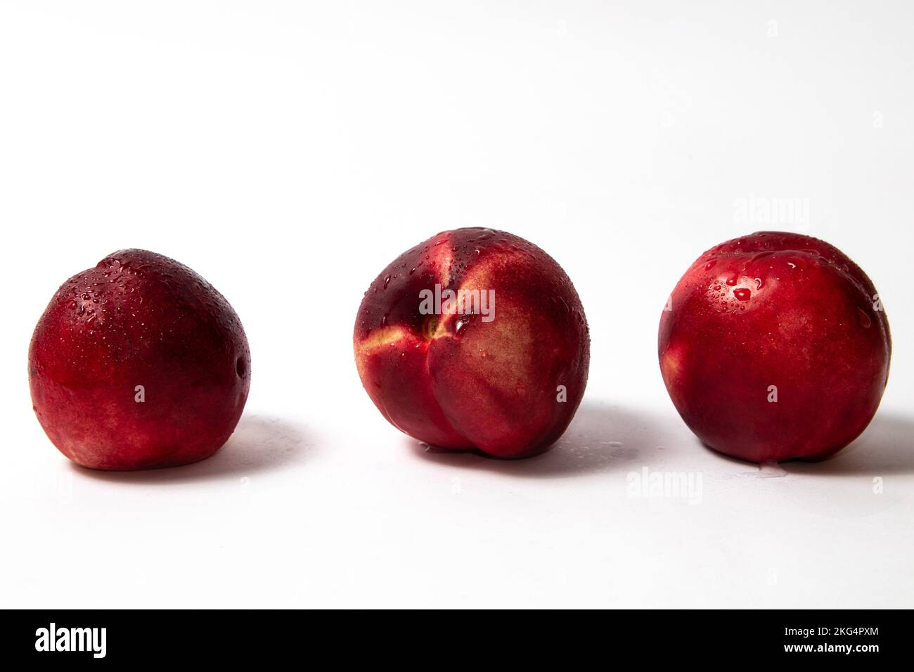 Fresh nectarine peaches on white background Stock Photo