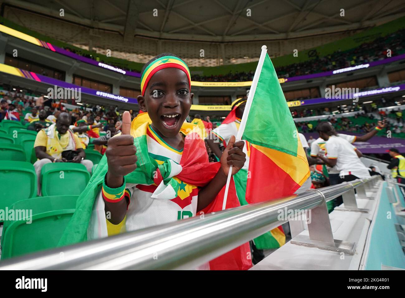 Doha, Qatar. 21st Nov, 2022. DOHA, QATAR - NOVEMBER 21: Young kid of Senegal celebrates before the FIFA World Cup Qatar 2022 group A match between Senegal and Netherlands at Al Thumama Stadium on November 21, 2022 in Doha, Qatar. (Photo by Florencia Tan Jun/PxImages) Credit: Px Images/Alamy Live News Stock Photo