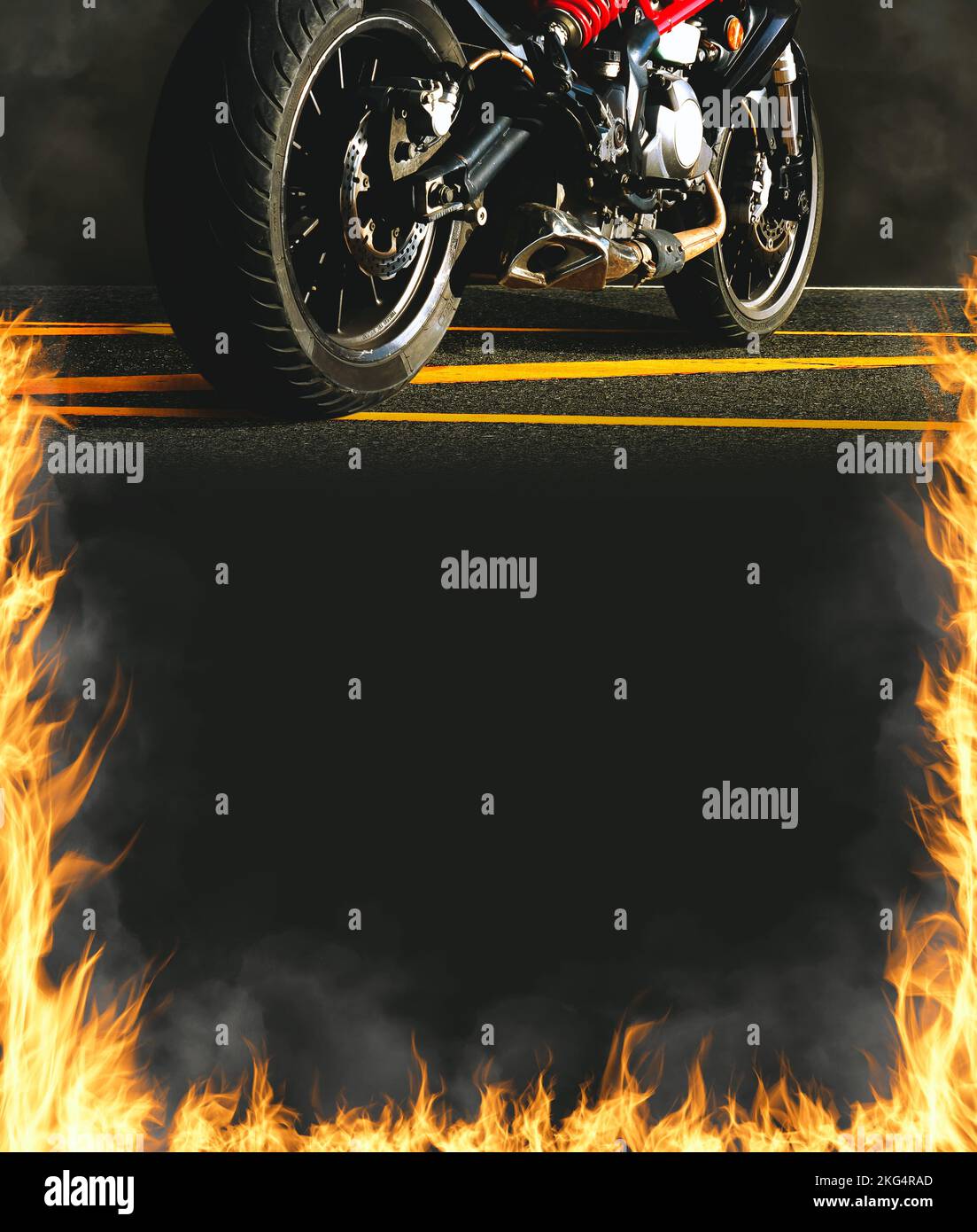 Motorbike and fire flames on vertical black frame background with copy space Stock Photo
