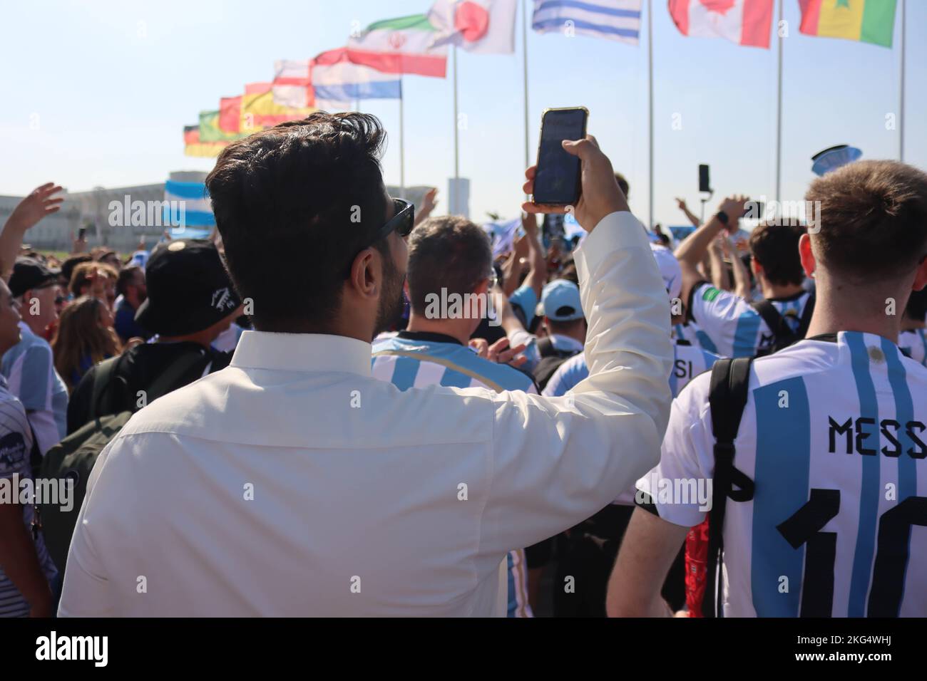 Doha, Qatar, 21th November 2022, Man of Qatar look Argentine fans party on the Corniche Stock Photo
