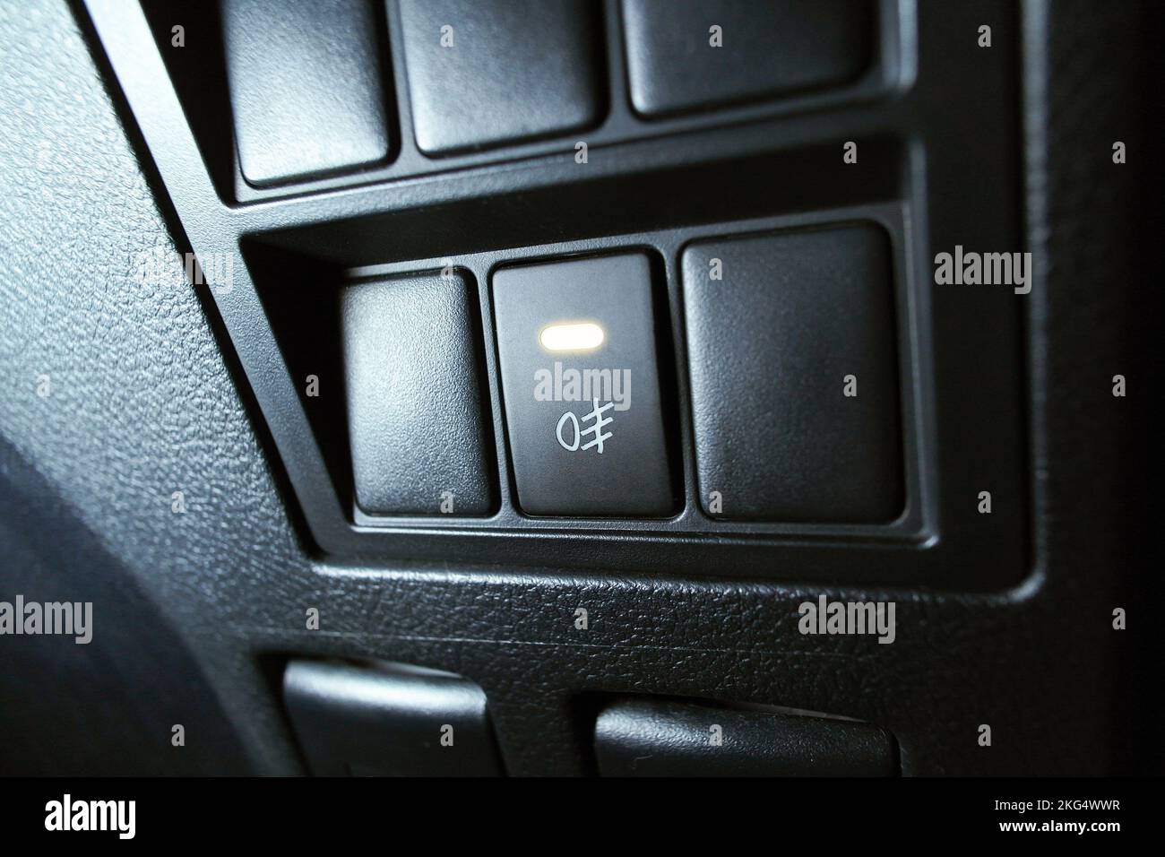Automotive spotlight button switch on dashboard in the car, The