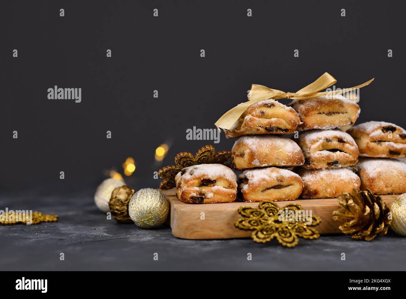 Small German Stollen cake pieces, a fruit bread with nuts, spices, and dried fruits with powdered sugar traditionally served during Christmas time Stock Photo