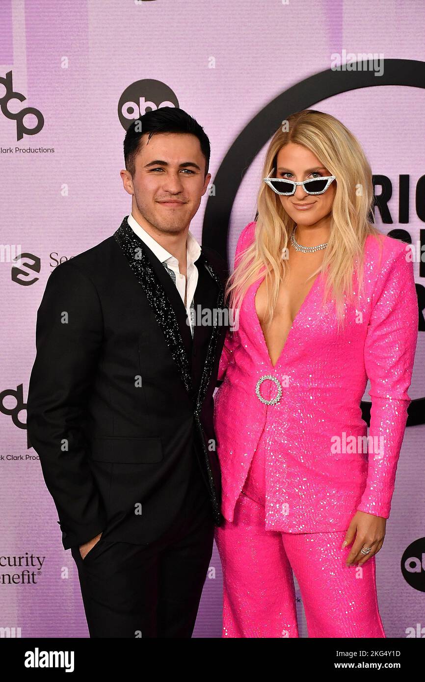 Chris Olsen, Meghan Trainor attend the 2022 American Music Awards at