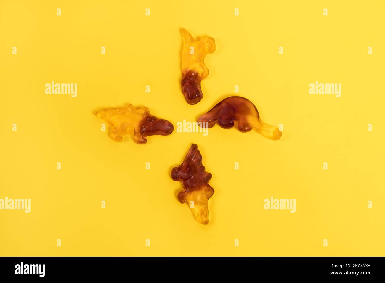 Two colored gummy candies on yellow background Stock Photo